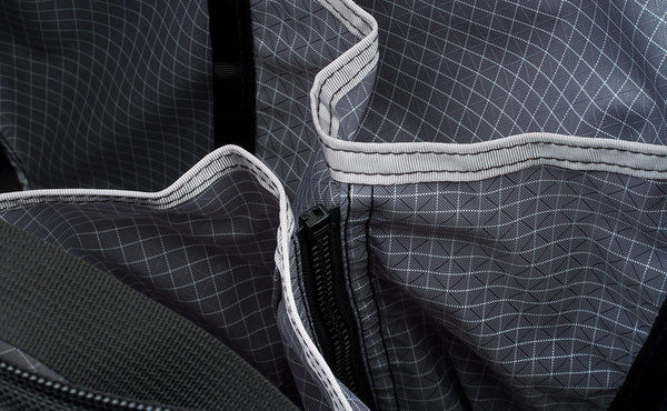 Close shot of zippable interior pockets in the main compartment.